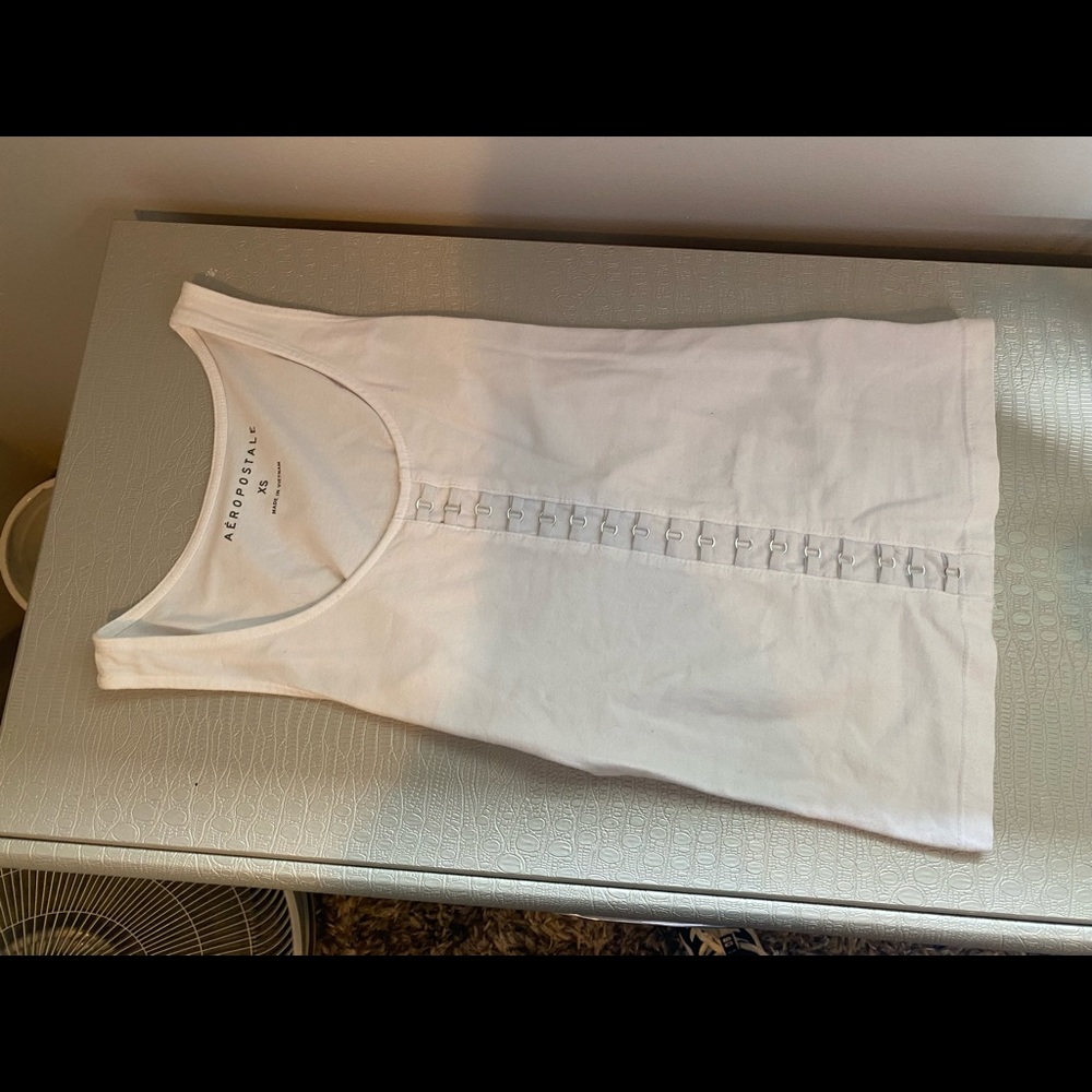 White tank top w/ rings down the middle(not open)